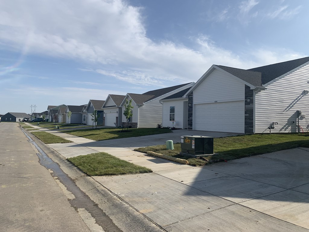 a row of houses on the side of a street